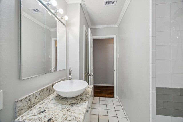 bathroom featuring crown molding, tile patterned floors, visible vents, and vanity