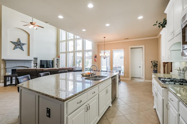 2402 Chesley Park Ct, Katy, TX 77494 - kitchen featuring a sink, appliances with stainless steel finishes, a chandelier, light tile patterned floors, and ceiling fan