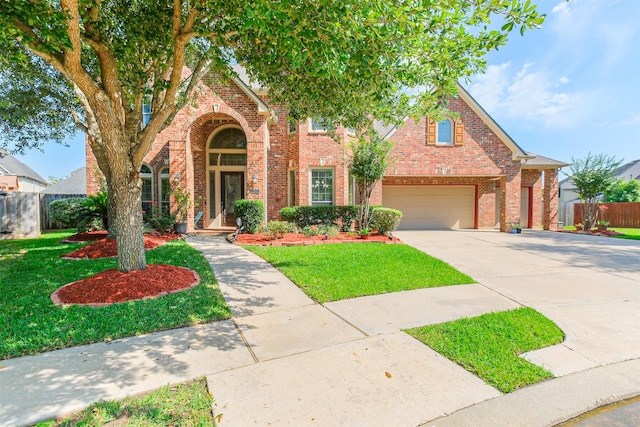 2402 Chesley Park Ct, Katy, TX 77494 - traditional-style house featuring brick siding, concrete driveway, and a garage