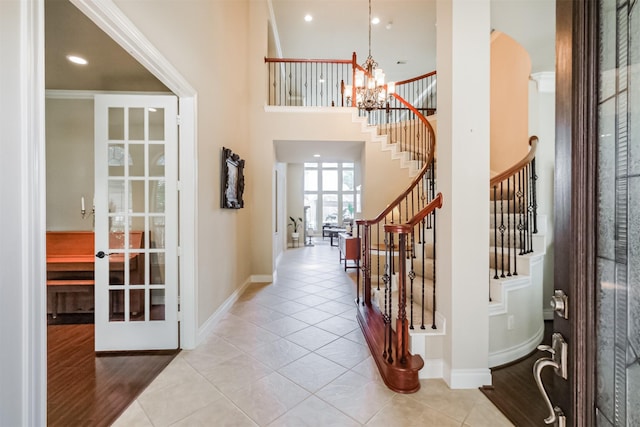 2402 Chesley Park Ct, Katy, TX 77494 - entrance foyer with french doors, stairs, a chandelier, tile patterned floors, and recessed lighting
