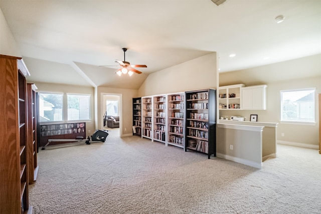 2402 Chesley Park Ct, Katy, TX 77494 - living area featuring light carpet, ceiling fan, an upstairs landing, baseboards, and vaulted ceiling