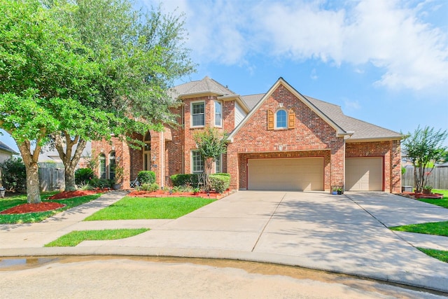 2402 Chesley Park Ct, Katy, TX 77494 - view of front of house featuring brick siding, concrete driveway, and a garage
