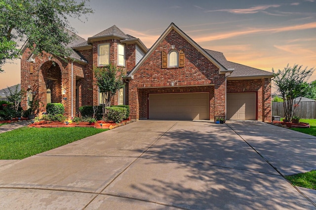 2402 Chesley Park Ct, Katy, TX 77494 - view of front of home featuring concrete driveway, brick siding, a front lawn, and a shingled roof