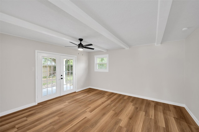 409 24th Ave N, Texas City, TX 77590 - spare room with french doors, beam ceiling, light wood-style flooring, and a ceiling fan