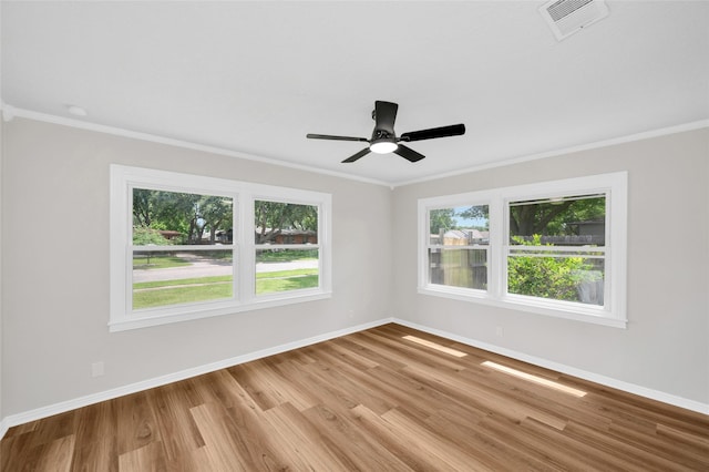 409 24th Ave N, Texas City, TX 77590 - spare room with crown molding, wood finished floors, and ceiling fan