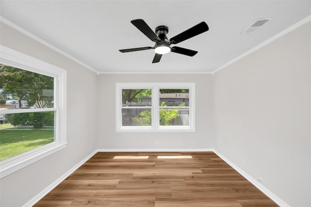 409 24th Ave N, Texas City, TX 77590 - empty room featuring a ceiling fan, light wood finished floors, and crown molding