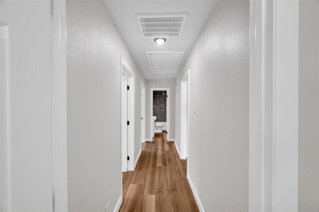 409 24th Ave N, Texas City, TX 77590 - hallway with attic access and wood finished floors