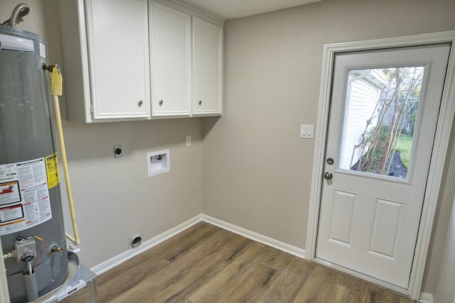laundry room featuring baseboards, cabinet space, gas water heater, dark wood finished floors, and hookup for an electric dryer