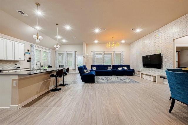 4723 Great Acre Ln, Fresno, TX 77545 - living room with recessed lighting, an inviting chandelier, light wood-style flooring, and visible vents