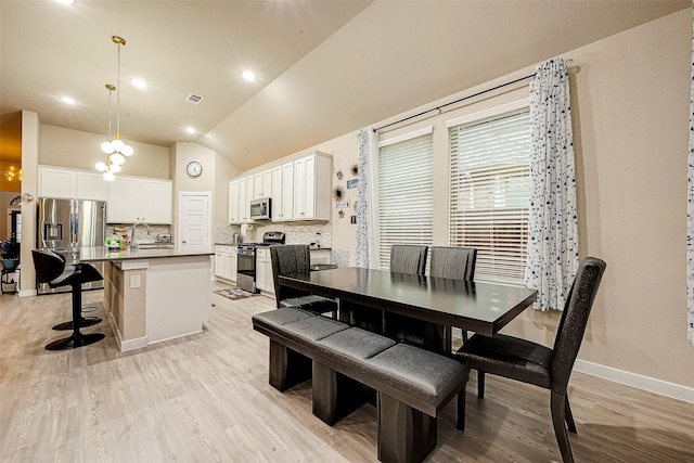 4723 Great Acre Ln, Fresno, TX 77545 - dining area with light wood-type flooring, baseboards, lofted ceiling, and visible vents