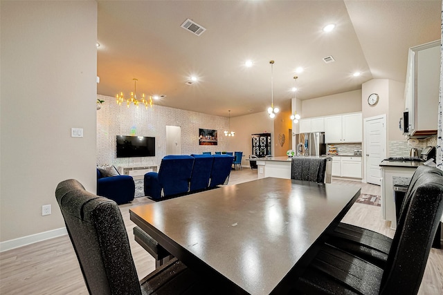 4723 Great Acre Ln, Fresno, TX 77545 - dining space with visible vents, light wood finished floors, baseboards, and a notable chandelier
