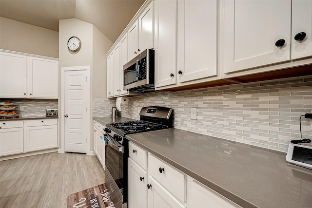 4723 Great Acre Ln, Fresno, TX 77545 - kitchen featuring tasteful backsplash, stainless steel appliances, light wood-style flooring, and white cabinets