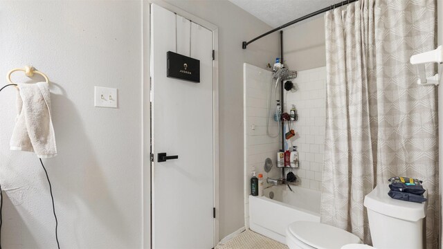 bathroom featuring toilet and shower / bath combo
