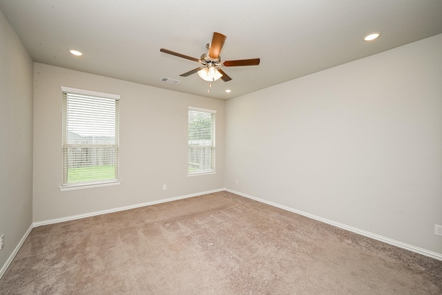 unfurnished room with visible vents, a ceiling fan, carpet flooring, and recessed lighting