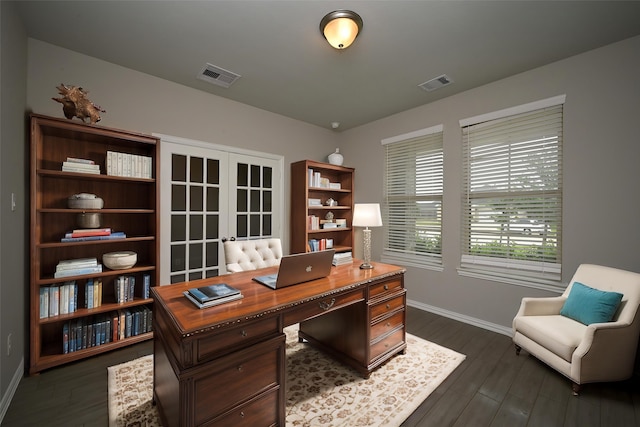 office featuring visible vents, baseboards, dark wood finished floors, and french doors