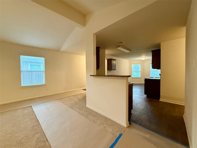 2093 Saras Way, Brookshire, TX 77423 - kitchen with baseboards, open floor plan, beam ceiling, and dark colored carpet