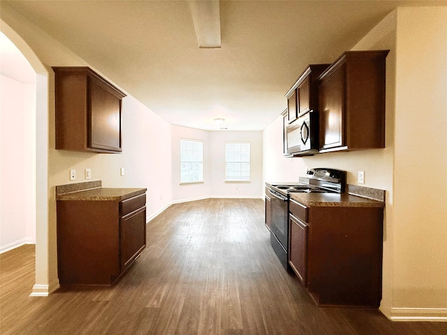 2093 Saras Way, Brookshire, TX 77423 - kitchen with dark countertops, electric range oven, baseboards, and dark wood-style flooring