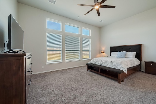 bedroom with carpet flooring, baseboards, visible vents, and ceiling fan