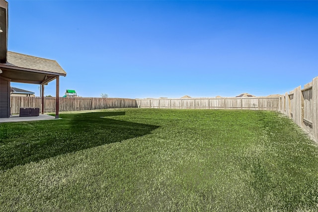 view of yard featuring a fenced backyard, a patio area, and cooling unit