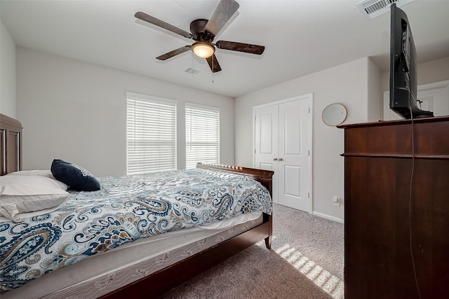 bedroom featuring baseboards, carpet, a ceiling fan, and visible vents