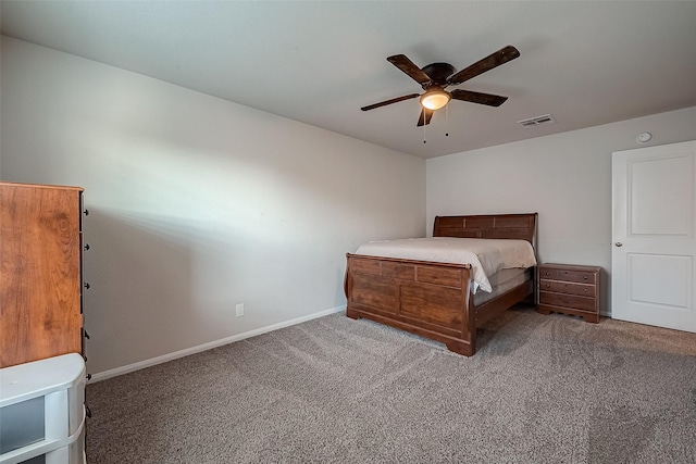 carpeted bedroom with a ceiling fan, baseboards, and visible vents