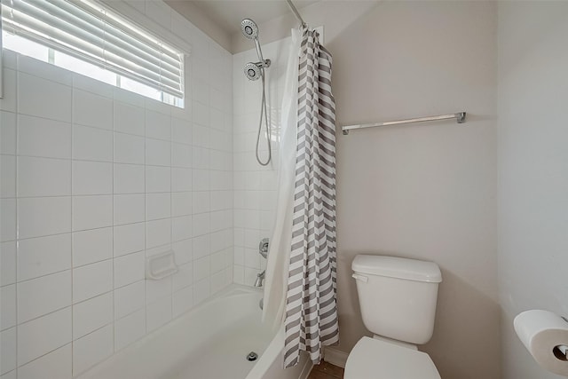 bathroom with toilet and shower / tub combo