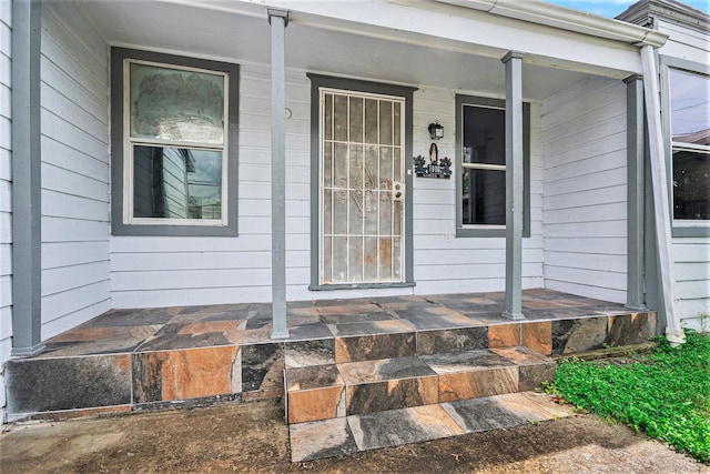 doorway to property featuring covered porch