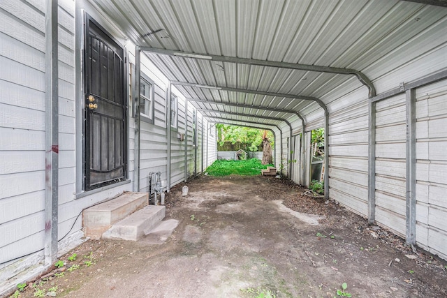 view of car parking featuring entry steps and a carport
