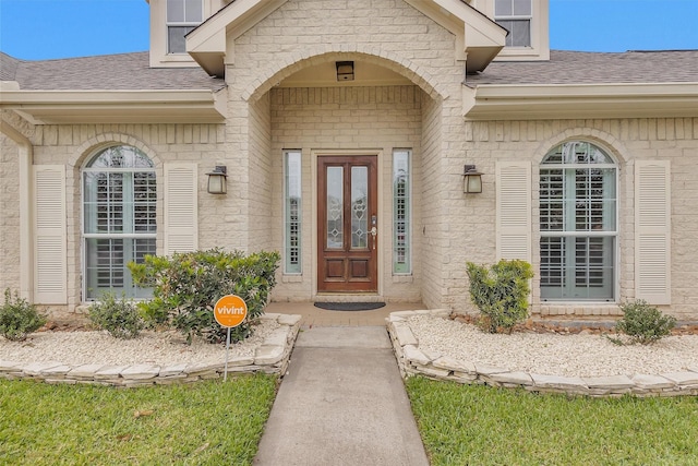 11406 Carson Ave, Pearland, TX 77584 - property entrance featuring brick siding and a shingled roof