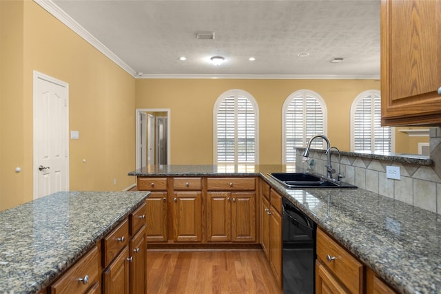 11406 Carson Ave, Pearland, TX 77584 - kitchen with brown cabinets, wood finished floors, dishwasher, a sink, and ornamental molding