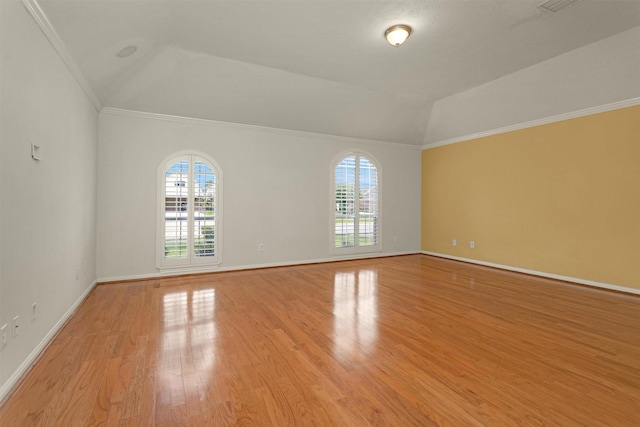 11406 Carson Ave, Pearland, TX 77584 - empty room with crown molding, light wood-style flooring, baseboards, and a healthy amount of sunlight