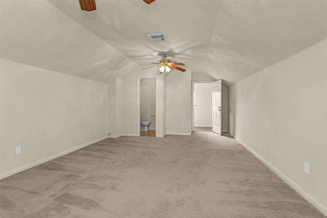 11406 Carson Ave, Pearland, TX 77584 - interior space featuring visible vents, baseboards, ceiling fan, carpet, and vaulted ceiling
