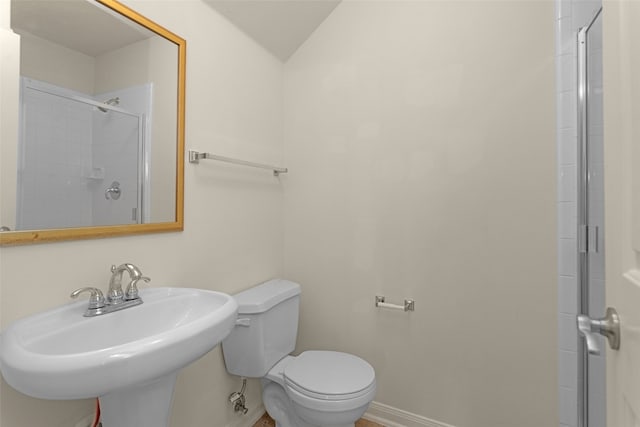 11406 Carson Ave, Pearland, TX 77584 - bathroom with baseboards, a sink, a shower with shower door, and toilet