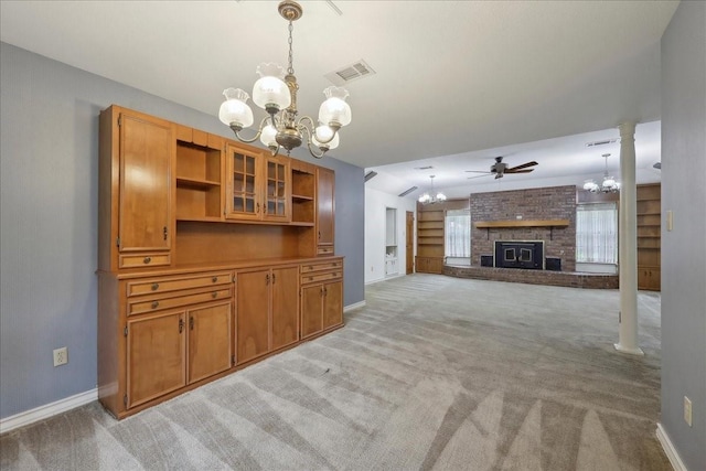 interior space with light colored carpet, baseboards, a brick fireplace, and visible vents