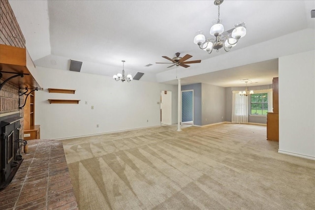 unfurnished living room with ceiling fan with notable chandelier, baseboards, carpet, and vaulted ceiling