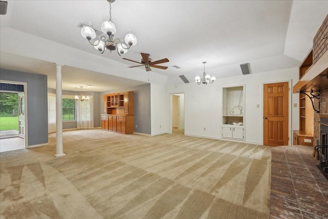 unfurnished living room with visible vents, decorative columns, baseboards, light colored carpet, and ceiling fan with notable chandelier