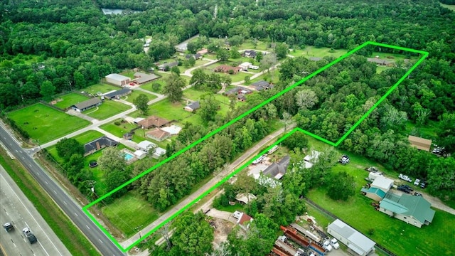 drone / aerial view with a view of trees
