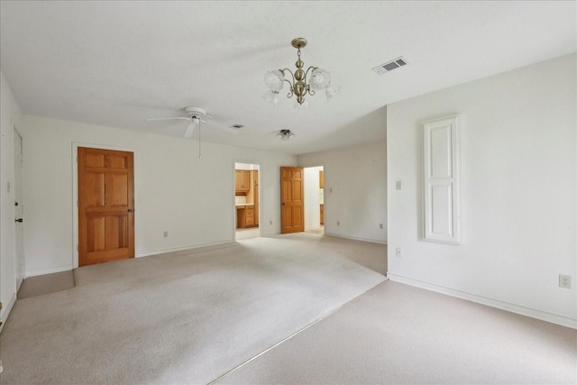 unfurnished room with light colored carpet, baseboards, and visible vents