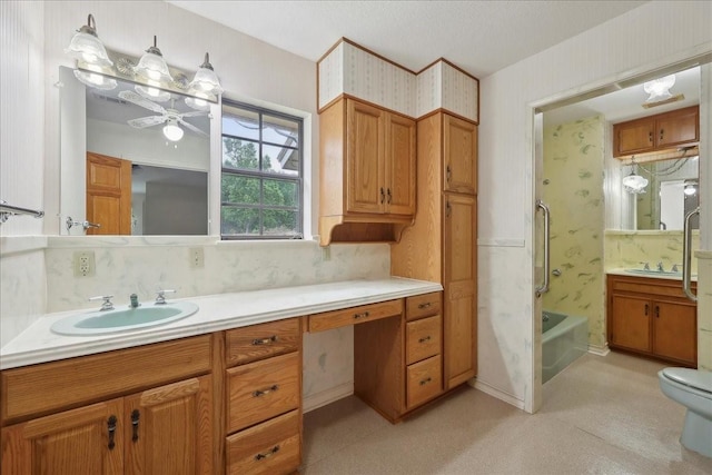 full bathroom featuring vanity,  shower combination, toilet, and wallpapered walls