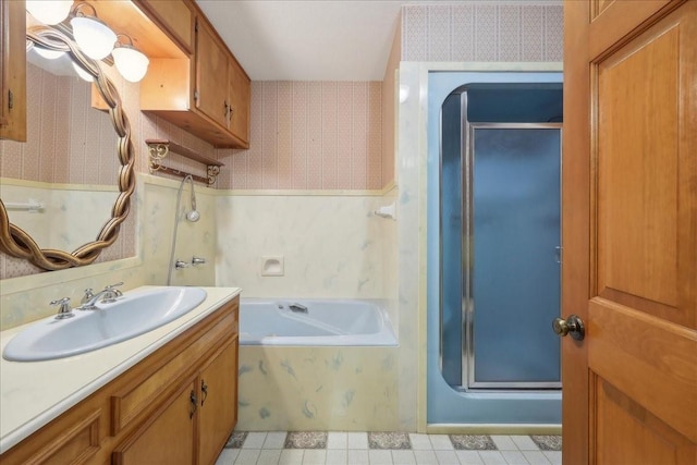 bathroom with a tub, wallpapered walls, a shower stall, and vanity