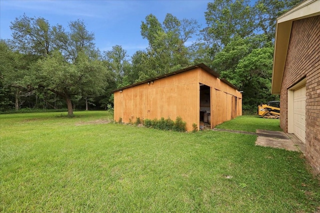 view of pole building with a yard