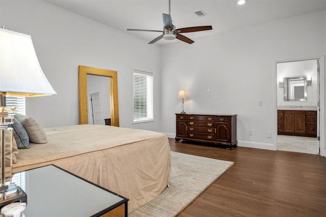 207 W Neyland St, Colmesneil, TX 75938 - bedroom featuring a sink, recessed lighting, baseboards, wood finished floors, and visible vents