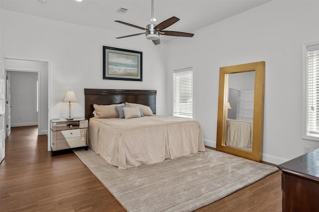 207 W Neyland St, Colmesneil, TX 75938 - bedroom featuring baseboards, visible vents, multiple windows, and wood finished floors