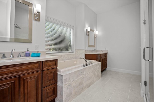 207 W Neyland St, Colmesneil, TX 75938 - bathroom featuring a sink, a bath, a stall shower, and two vanities