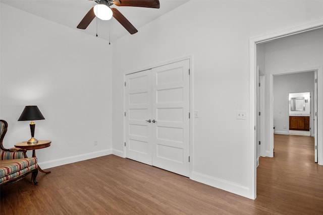 207 W Neyland St, Colmesneil, TX 75938 - unfurnished room with baseboards, a ceiling fan, and wood finished floors