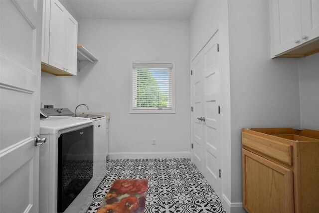 207 W Neyland St, Colmesneil, TX 75938 - laundry area featuring washer / dryer, light tile patterned floors, baseboards, and cabinet space