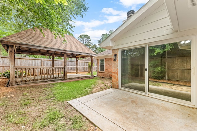 view of yard with a gazebo, a patio, and fence