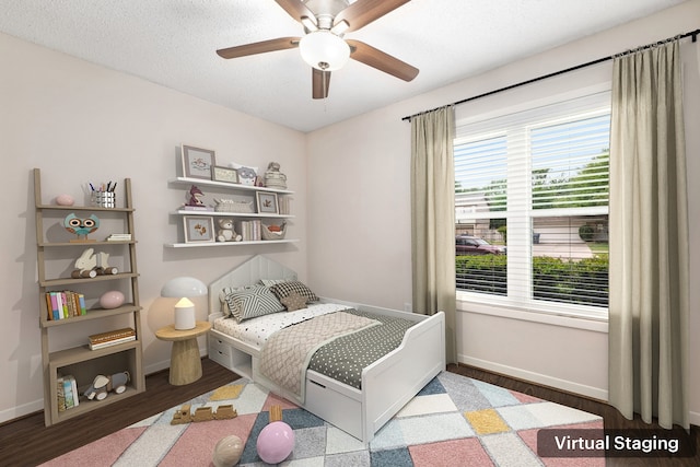 bedroom with baseboards, a ceiling fan, and wood finished floors