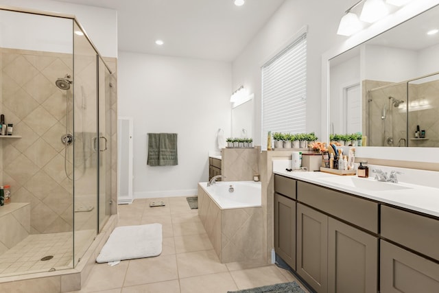 bathroom featuring tile patterned flooring, a shower stall, a garden tub, vanity, and recessed lighting