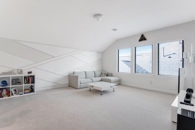 living room with lofted ceiling, carpet floors, and baseboards